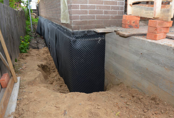 SJ Waterproofing Pros technician performing targeted Waterproofing assessment in Inwood, NY